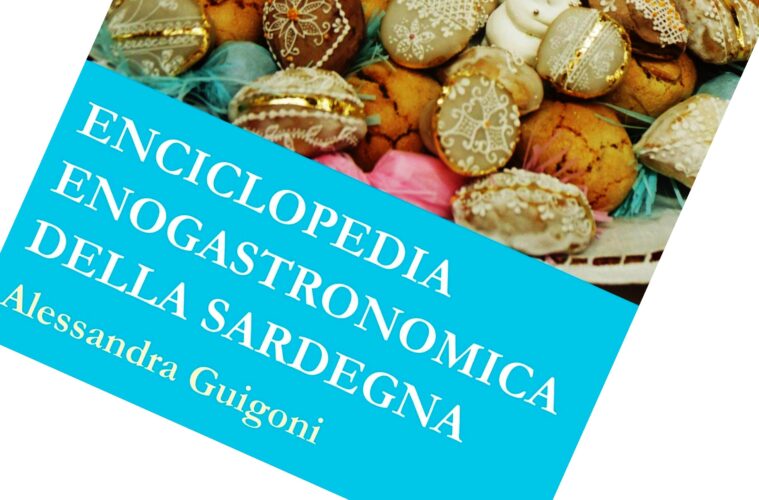 Book cover: Enciclopedia Enogastronomica della Sardegna on a bright blue banner over a background of decorated pastries/cookies, rotated diagonal view.