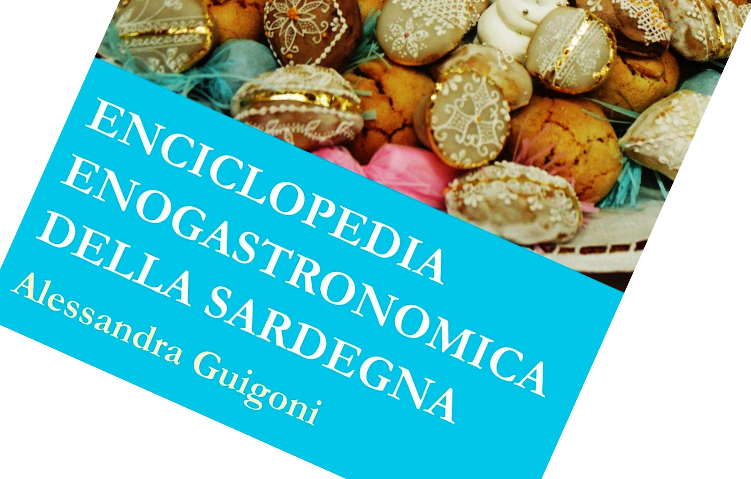 Book cover: Enciclopedia Enogastronomica della Sardegna on a bright blue banner over a background of decorated pastries/cookies, rotated diagonal view.