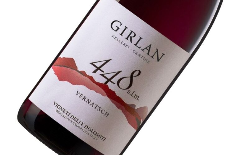 Red wine bottle angled to show label: 'Girlan', '4488', 'Vernatsch' with a red mountain graphic.