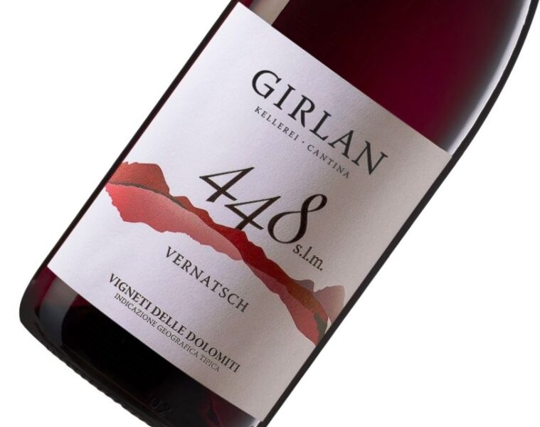 Red wine bottle angled to show label: 'Girlan', '4488', 'Vernatsch' with a red mountain graphic.