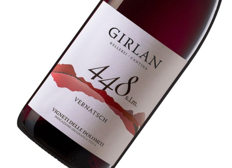 Red wine bottle angled to show label: 'Girlan', '4488', 'Vernatsch' with a red mountain graphic.
