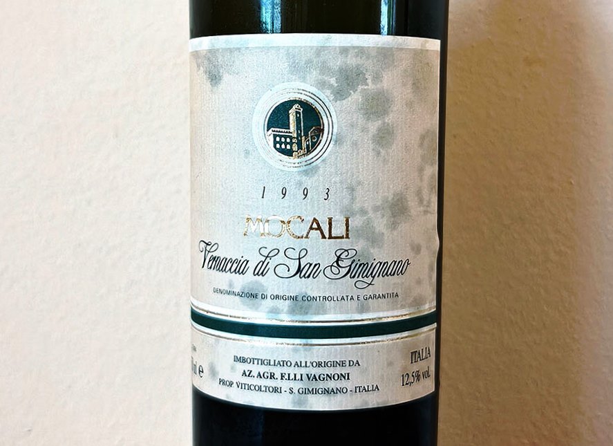 Wine bottle label showing the year 1993 and the text Tennaccia di San Gimignano with a circular crest above.