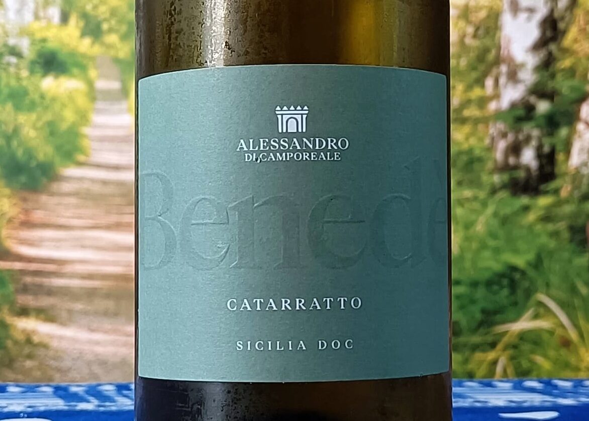 Wine bottle label: Alessando di Camporeale Catarratto Sicilia DOC, outdoor scene in soft focus
