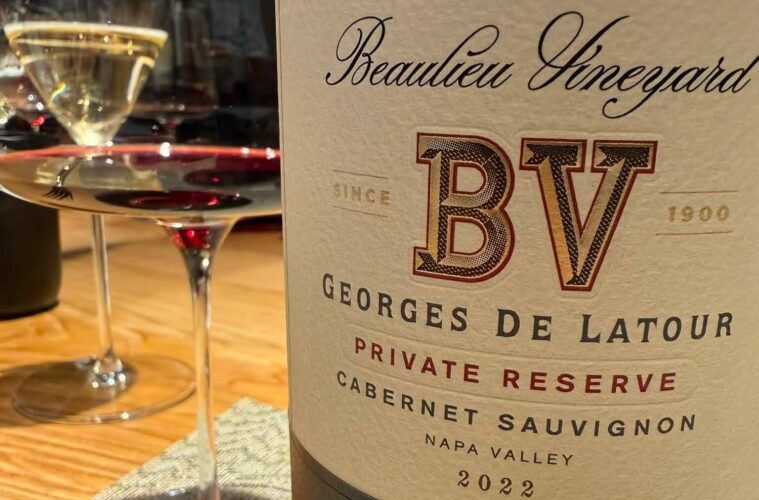 Close-up of a wine bottle label reading Beaulieu Vineyards BV Georges De Latour Private Reserve Cabernet Sauvignon Napa Valley 2022 with a wine glass beside it