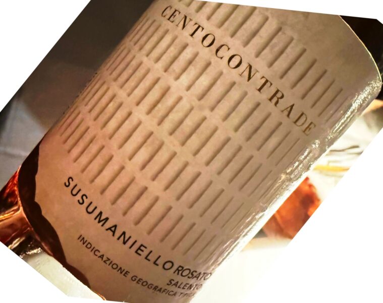 Close-up of a wine bottle label with Italian text and a textured beige background, suggesting origin and designation of the wine.