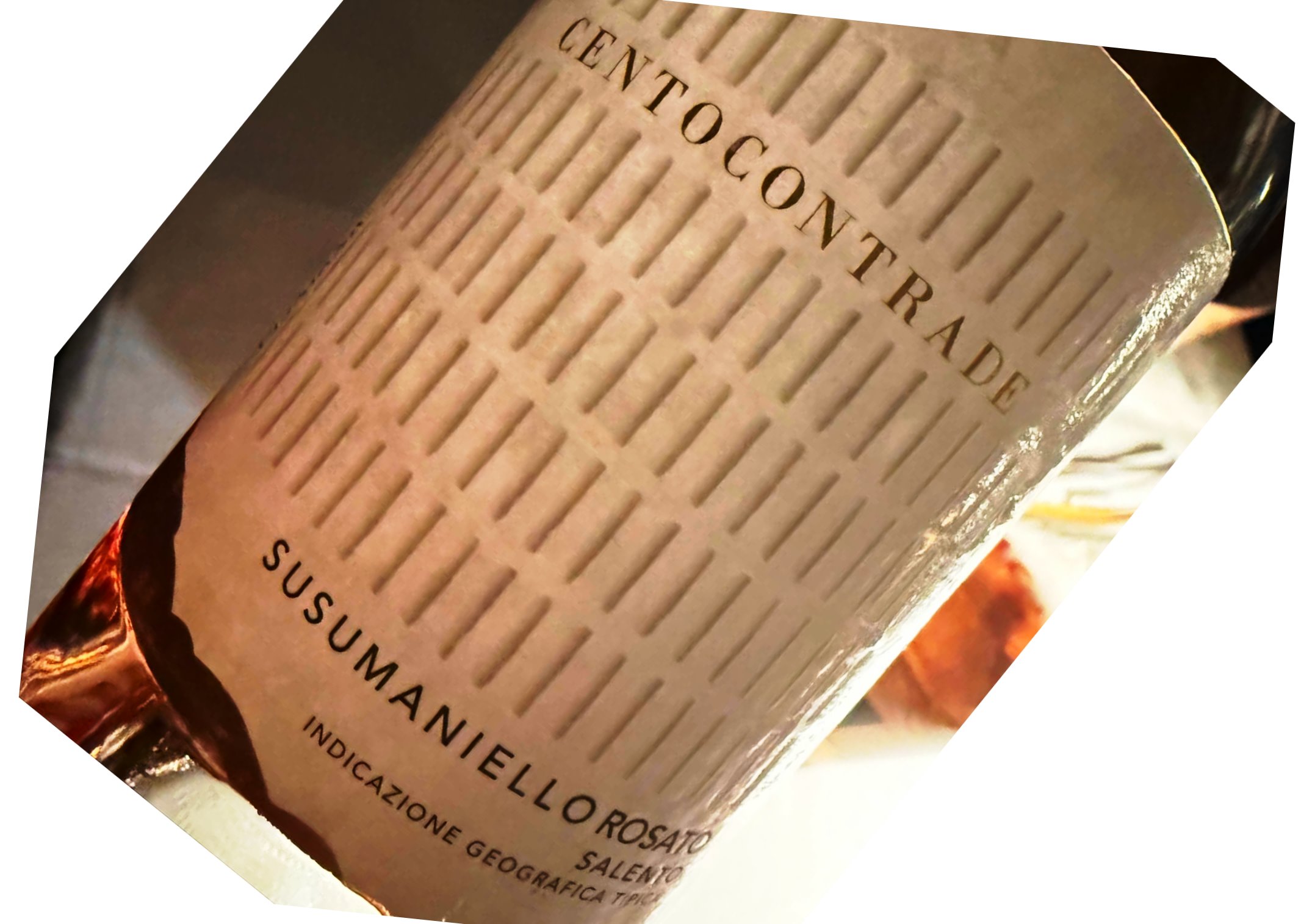 Close-up of a wine bottle label with Italian text and a textured beige background, suggesting origin and designation of the wine.